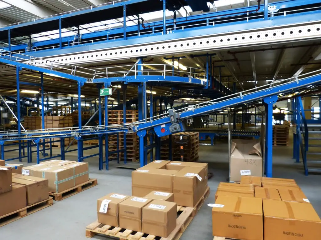 Large production facility with conveyor lines and stacked cases